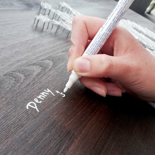 Gästebuch Fadenbild wird mit Lackstift unterschrieben